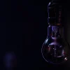 non-luminous-lamp-hangs-dark-blurred-background-copy-space